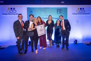 Group of people on stage with a certificate