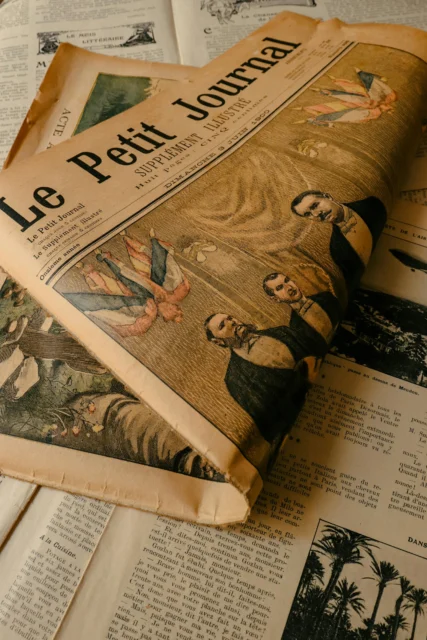 Vintage French newspaper Le Petit Journal with a classic illustration on the front page.