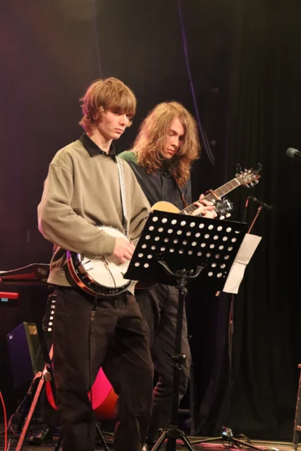 Two musicians performing on stage