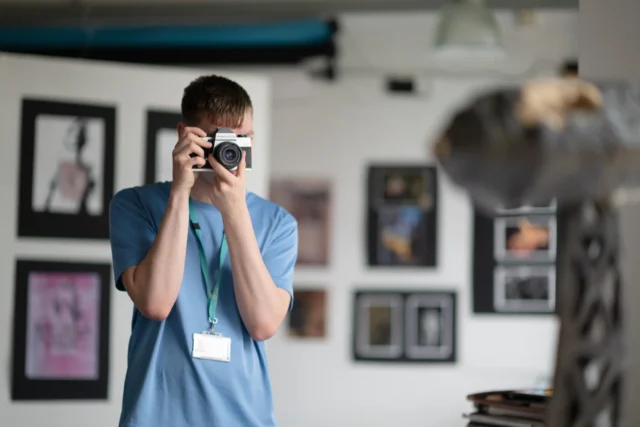 Man taking a photo with a camera
