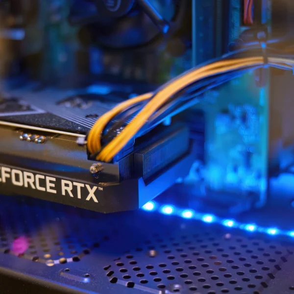 A close-up of a computer's graphics card with the text 'GEFORCE RTX' visible, surrounded by blue and yellow wires.