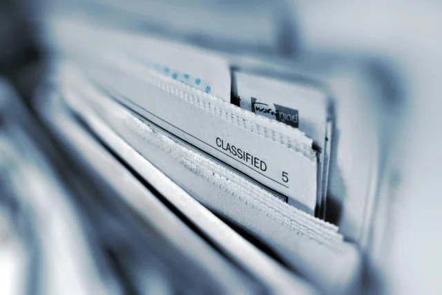 Close-up of classified documents in a file.