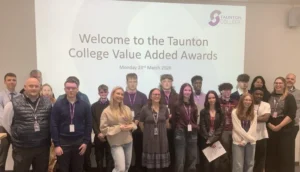 Group of people posing for a photo at the Taunton College Value Added Awards.