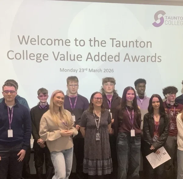 Group of people posing for a photo at the Taunton College Value Added Awards.