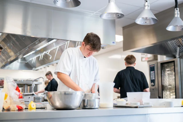 Chef preparing food in a commercial kitchen
